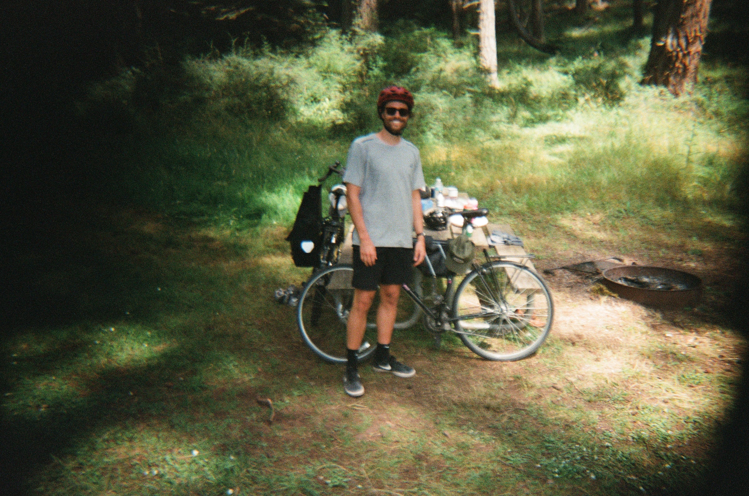 me posing in front of my bike at our campsite in Moran State Park
