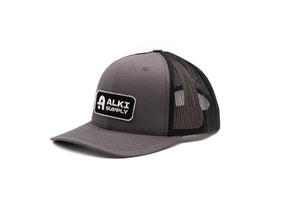 gray and black trucker hat with alki patch