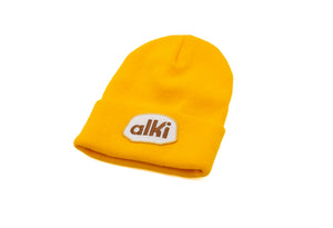 yellow beanie with alki patch